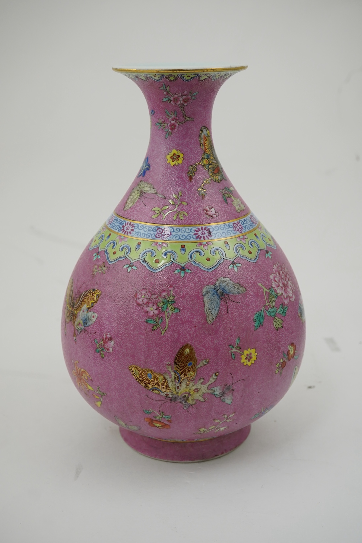 A Chinese pink-ground sgraffito pear-shaped vase, yuhuchunping, Daoguang six character seal mark and of the period (1821-50)